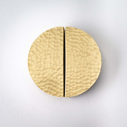 Hammered Demi Lune, Solid Brass Half Moon Cabinet PullsThis Demi Lune Hammered Pull is crafted from solid brass and finished with a unique hammered texture. With its half-moon shape, it's a charming addition to any kitchpullHammered Demi Lune, Solid Brass Half Moon Pulls