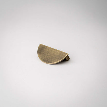 Demi Lune, Solid Brass Half Moon Cabinet PullsOur handmade Demi Lune cabinet handle is designed to be mounted in pairs to form a full circle or mounted horizontally as a half moon. In either orientation, it exudpullDemi Lune, Solid Brass Half Moon Pulls