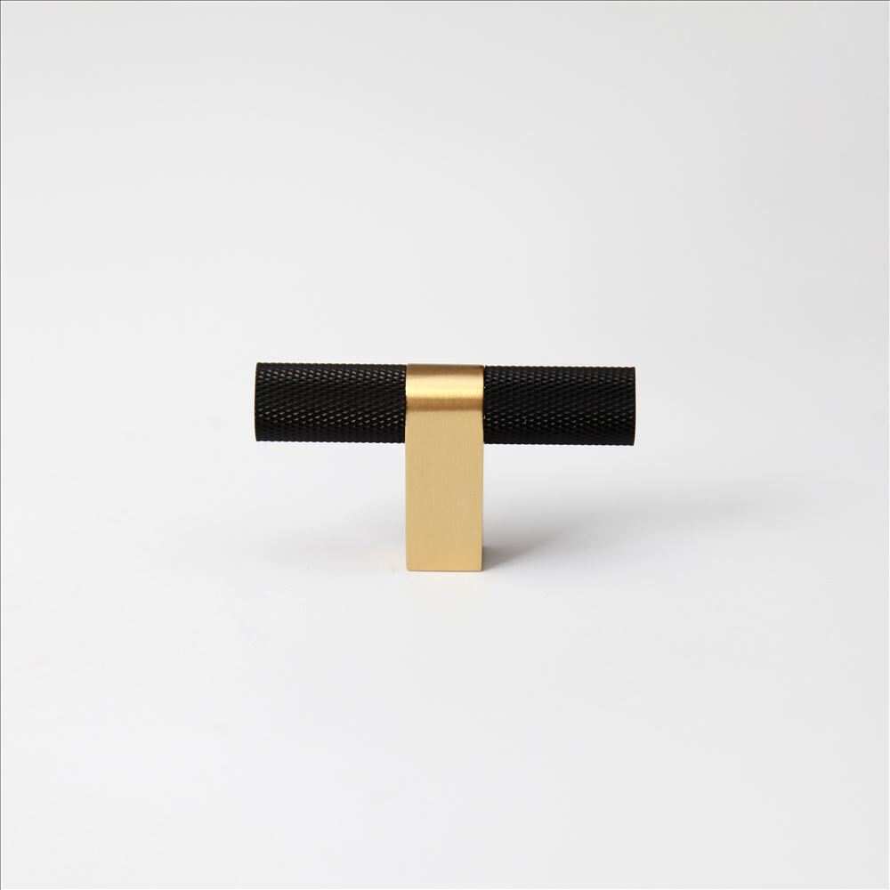 Bold, Black & Gold Knurled Cabinet Pulls Go BOLD in your home!Our Bold, Black and "gold" cabinet pull brings a modern feel to your cabinetry. Its two-toned style is visually fresh, while its knurled matpullBold, Black & Gold Knurled Solid Brass Cabinet Pulls